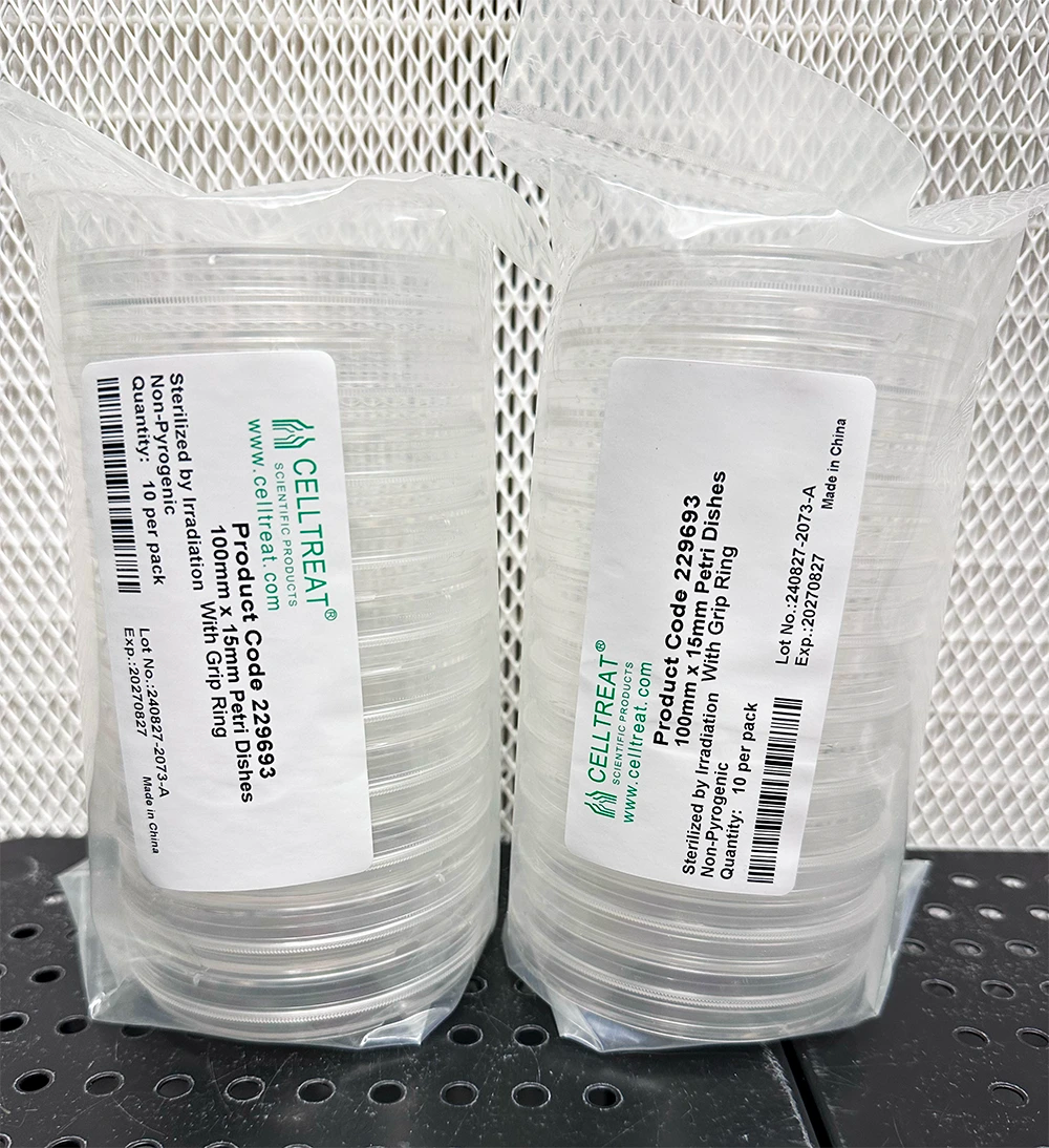 Stack of 100mm sterile petri dishes with grip ring, shown in 20-pack packaging